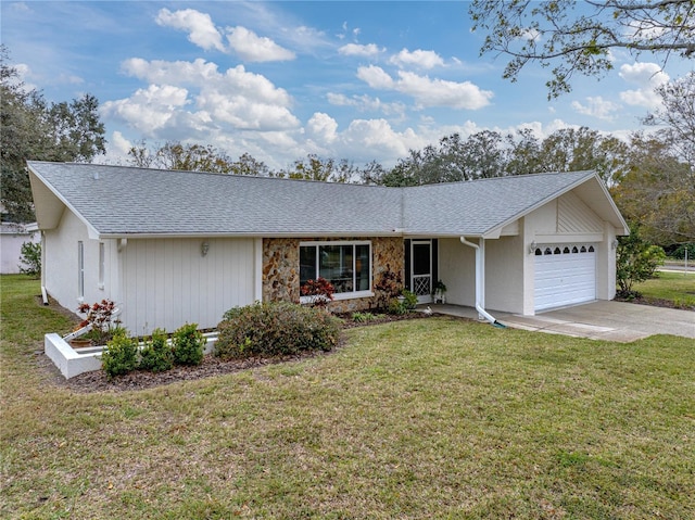 ranch-style home featuring a garage and a front lawn