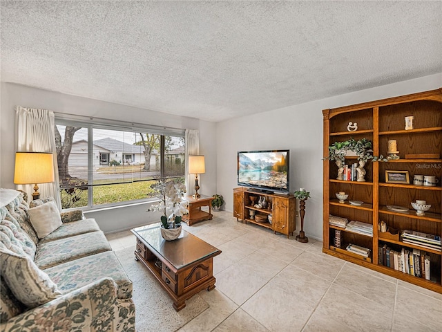 living room with light tile patterned floors and a textured ceiling