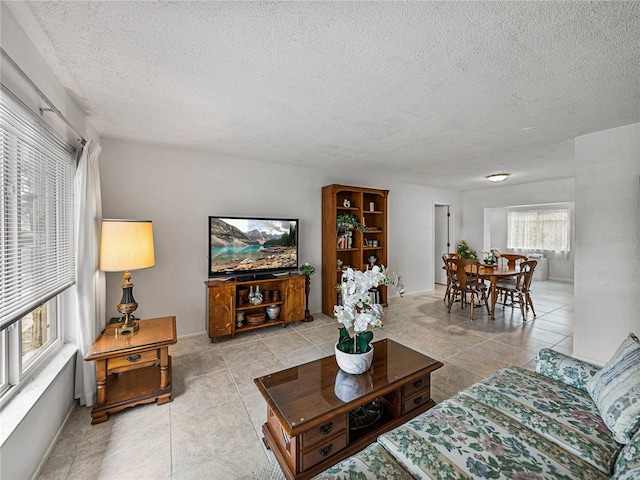 tiled living room with a textured ceiling