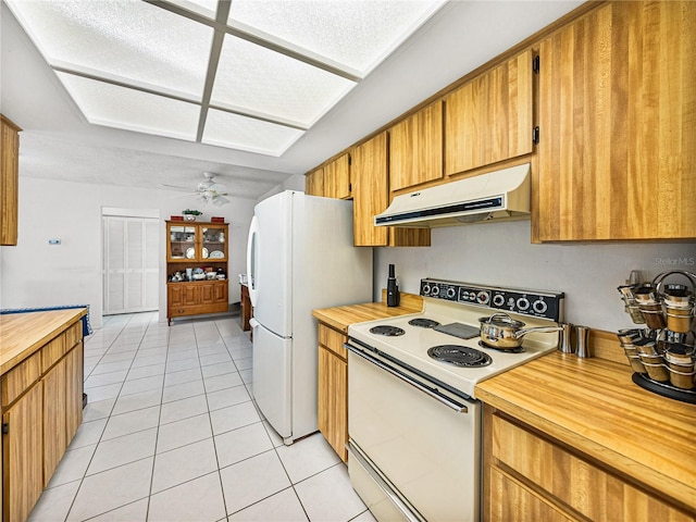 kitchen with ceiling fan, white appliances, and light tile patterned floors