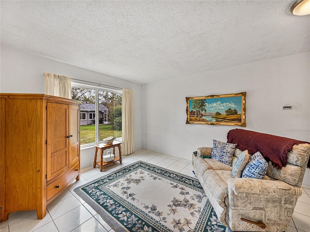 living room featuring light tile patterned floors and a textured ceiling