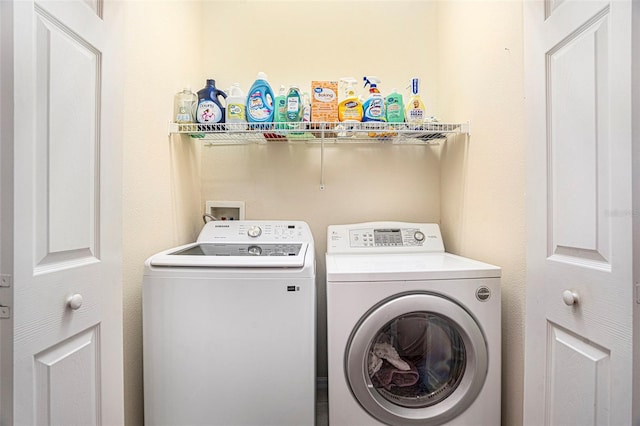 laundry area with separate washer and dryer