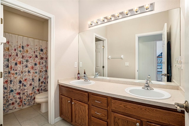 bathroom with tile patterned flooring, vanity, curtained shower, and toilet