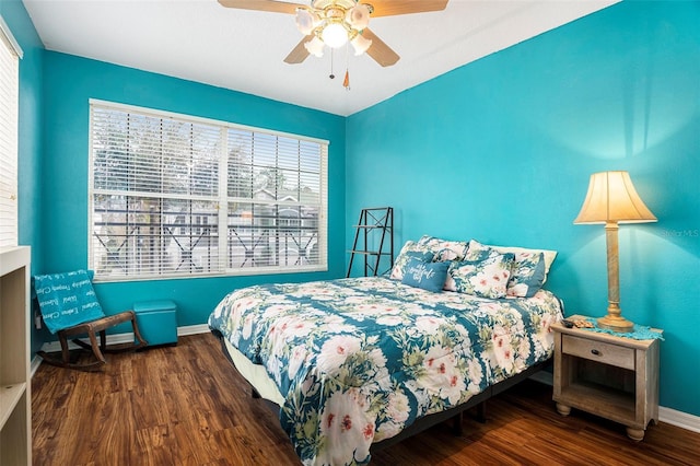 bedroom with hardwood / wood-style flooring and ceiling fan