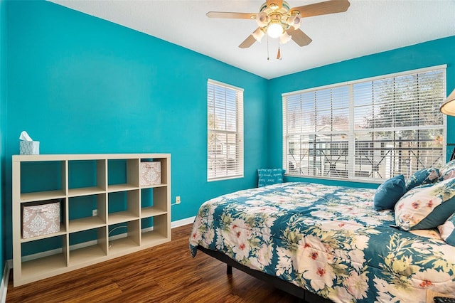 bedroom featuring wood-type flooring and ceiling fan