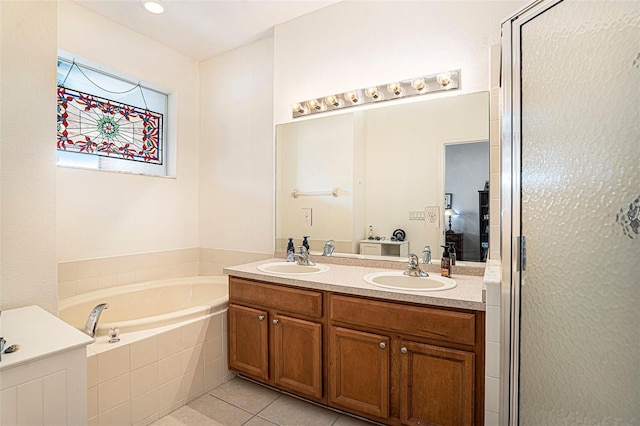 bathroom with vanity, independent shower and bath, and tile patterned flooring