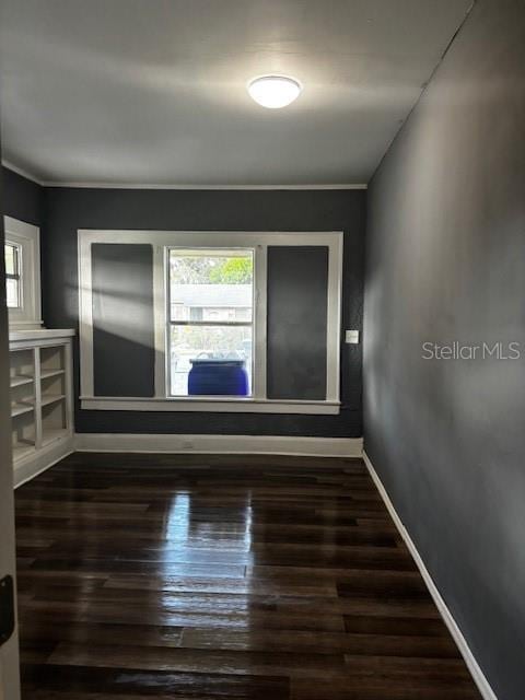 empty room featuring dark hardwood / wood-style flooring