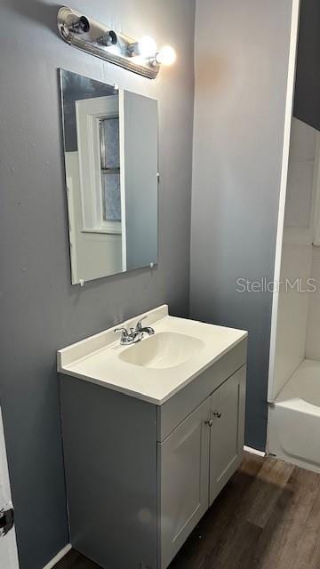 bathroom with wood-type flooring and vanity