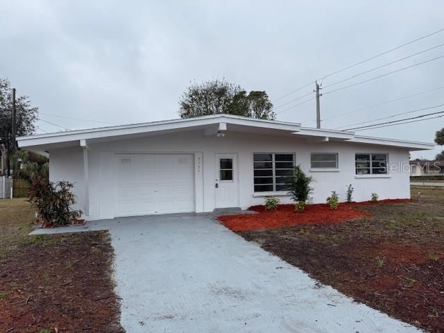 ranch-style home with a garage