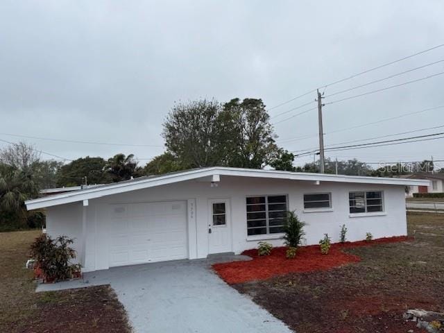 ranch-style house featuring a garage