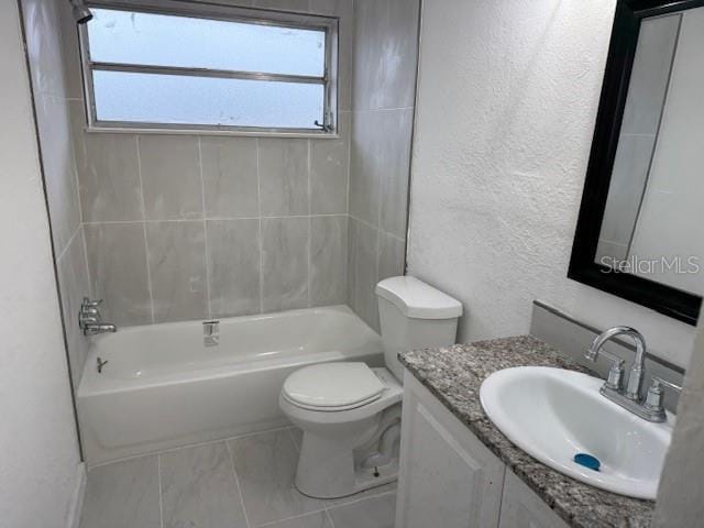 full bathroom with shower / washtub combination, toilet, and vanity