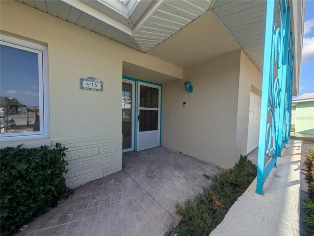 entrance to property featuring a garage