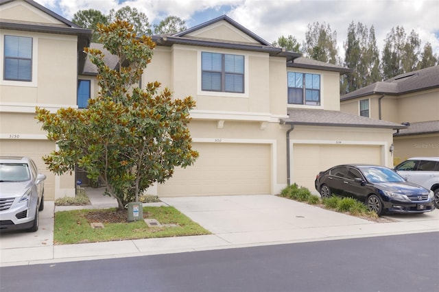 multi unit property featuring a garage