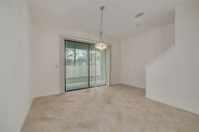 unfurnished dining area featuring a notable chandelier