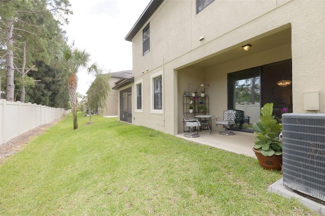 view of yard featuring a patio area and central AC