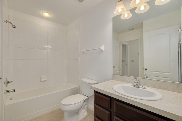 full bathroom featuring tiled shower / bath combo, toilet, tile patterned flooring, and vanity