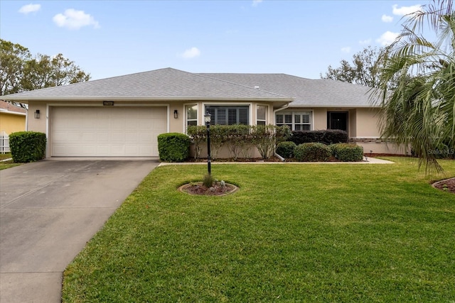 ranch-style home with a garage and a front yard