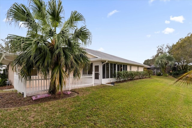 view of yard with a sunroom