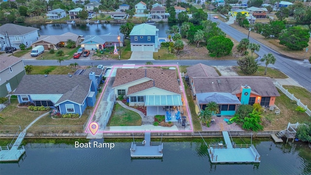 birds eye view of property featuring a water view