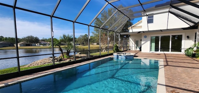 view of swimming pool with a patio, a lanai, a water view, and an in ground hot tub