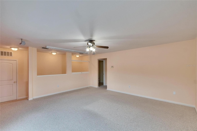 unfurnished room featuring ceiling fan, baseboards, visible vents, and light colored carpet