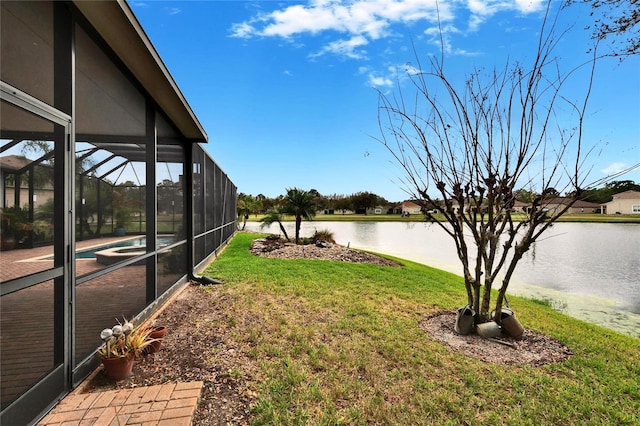 view of yard featuring a water view, glass enclosure, a patio area, and an outdoor pool