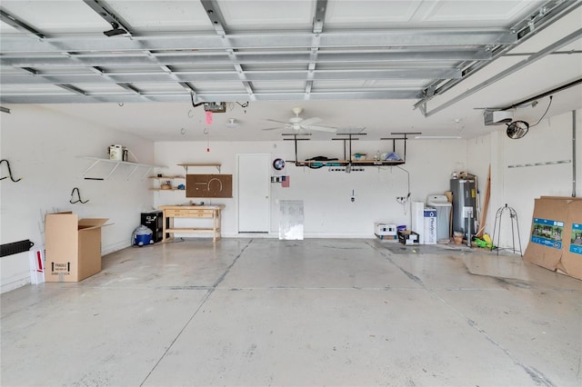 garage featuring water heater, washer / dryer, and a garage door opener