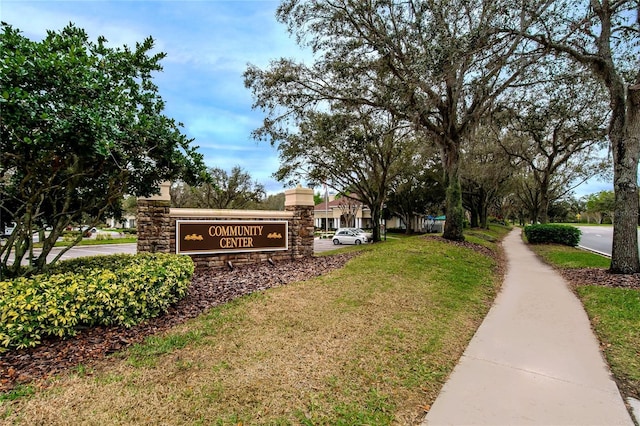 view of property's community with a yard