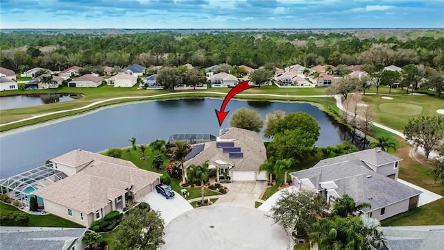 bird's eye view with golf course view, a water view, and a residential view