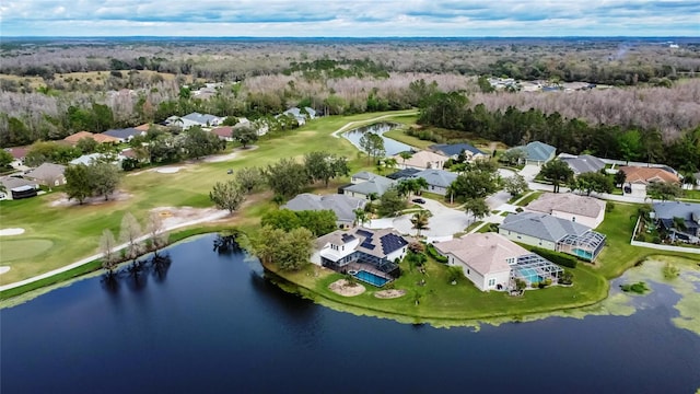 aerial view with a water view, a forest view, view of golf course, and a residential view