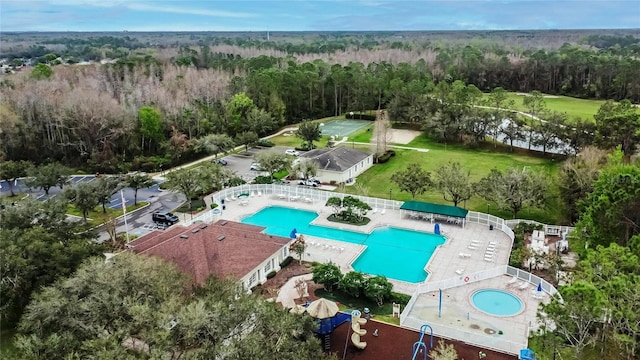 birds eye view of property featuring a view of trees