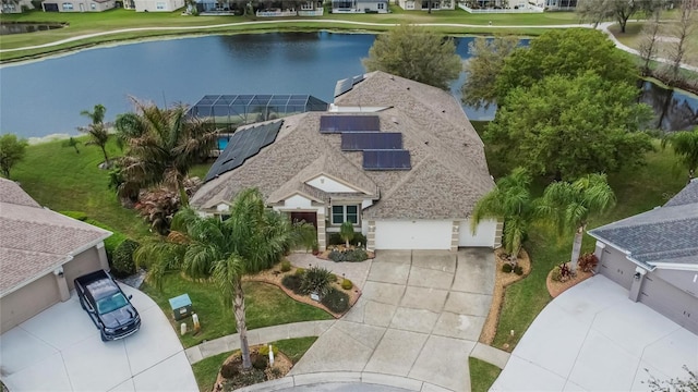 drone / aerial view featuring a water view and a residential view