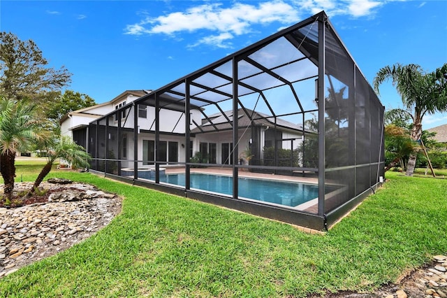 pool with glass enclosure and a lawn