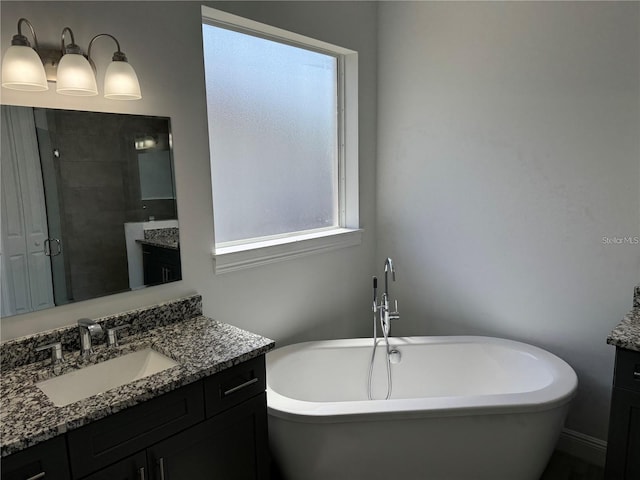 bathroom featuring separate shower and tub and vanity