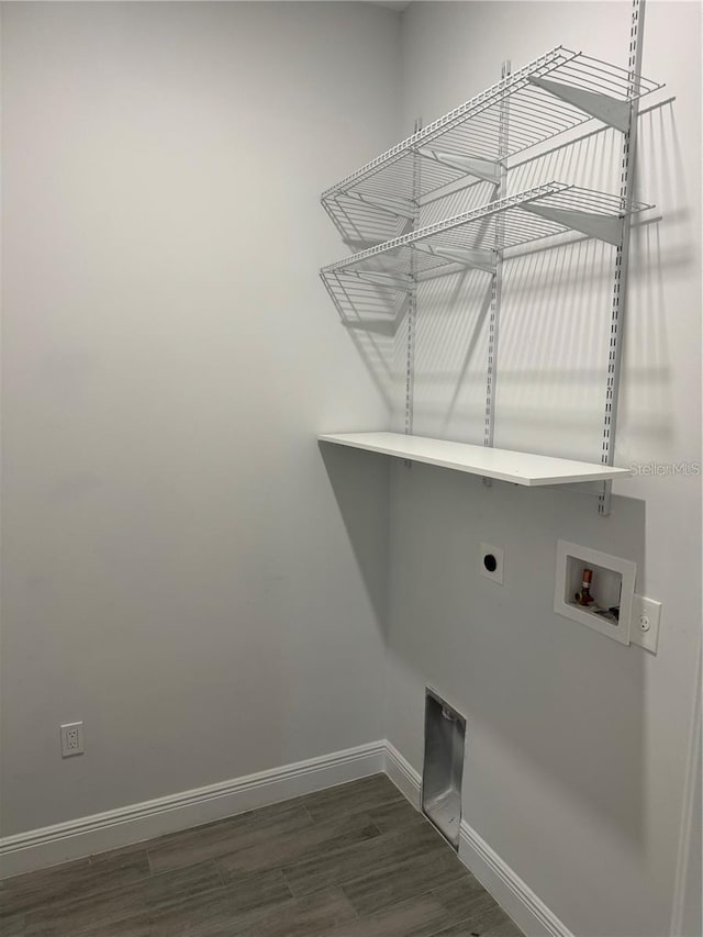 laundry room with washer hookup, electric dryer hookup, and dark hardwood / wood-style floors