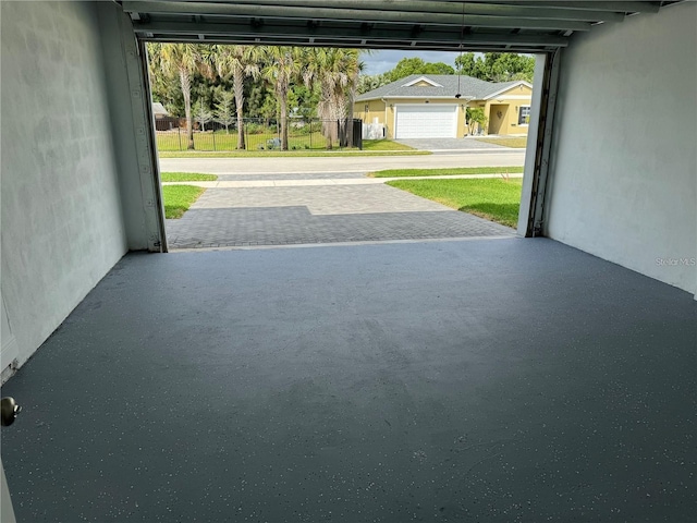 garage featuring a lawn