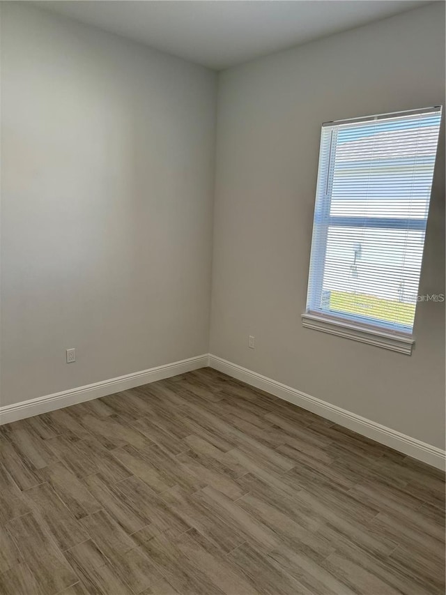 unfurnished room featuring wood-type flooring