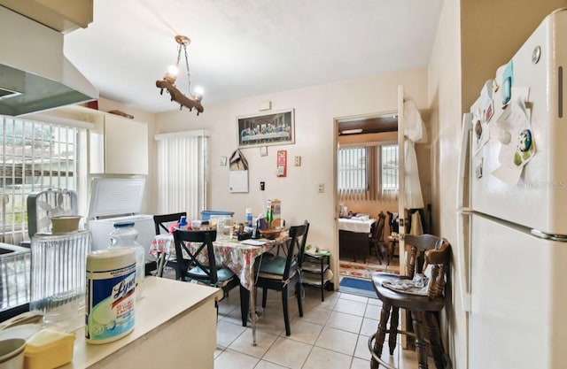 dining room featuring light tile patterned flooring