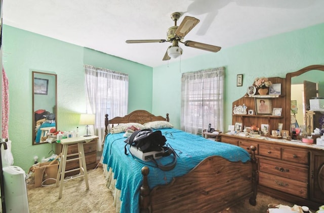 carpeted bedroom featuring ceiling fan