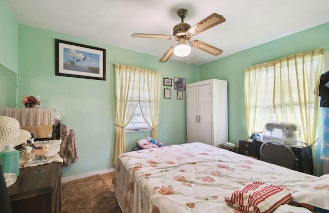 carpeted bedroom featuring ceiling fan