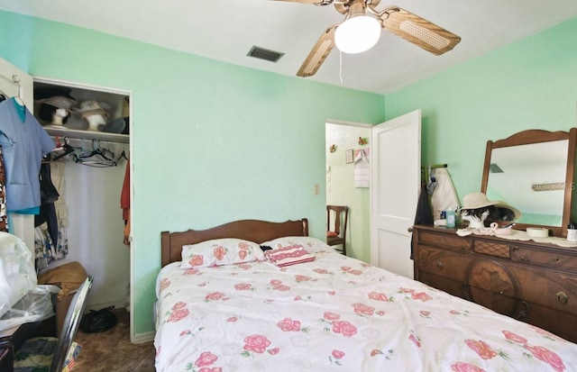 carpeted bedroom with a closet and ceiling fan