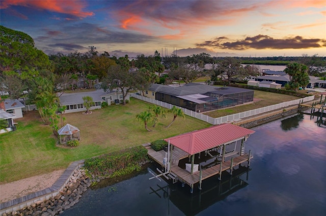 aerial view at dusk with a water view