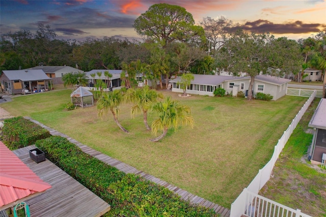 aerial view at dusk featuring a residential view