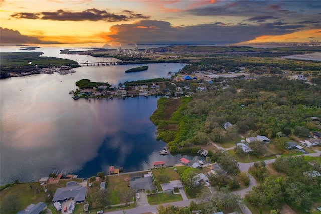 aerial view at dusk with a water view