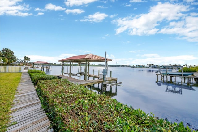 dock area with a water view and boat lift