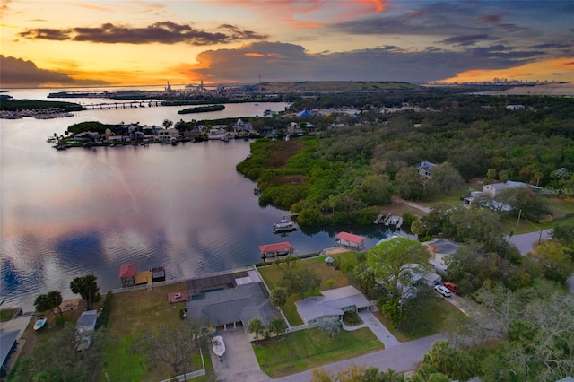 aerial view at dusk with a water view