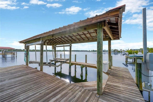 view of dock with a water view and boat lift