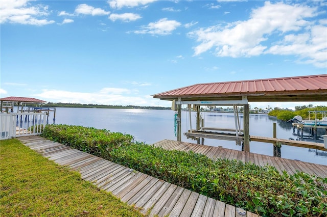 dock area featuring a water view and boat lift