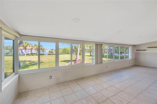 unfurnished sunroom featuring tile patterned floors