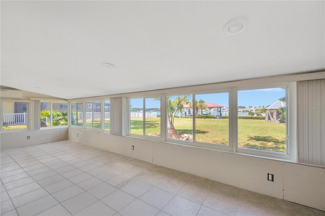 unfurnished sunroom with tile patterned flooring